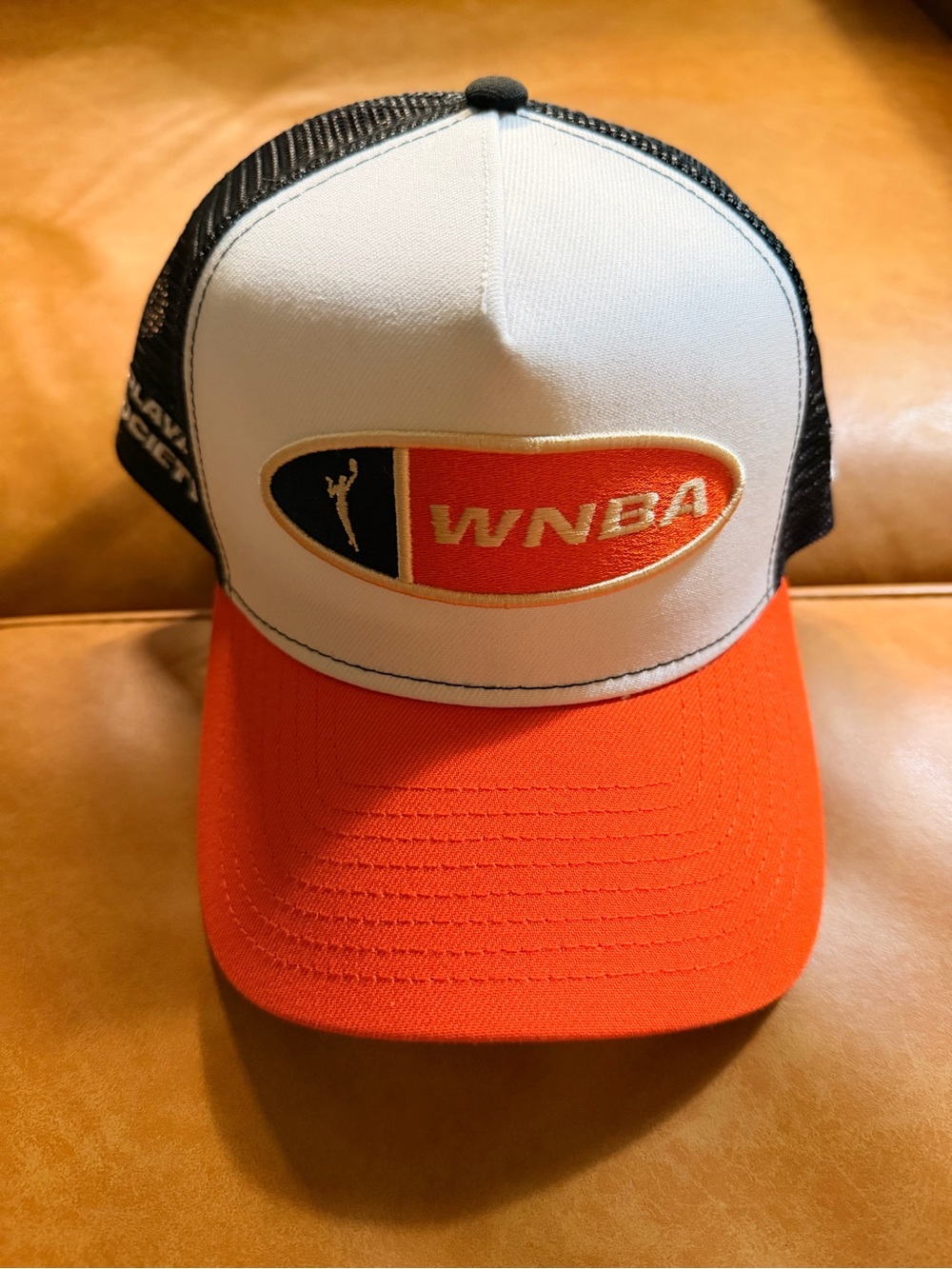 New Era Plata Society WNBA Logo Trucker Hat in Orange, White & Black